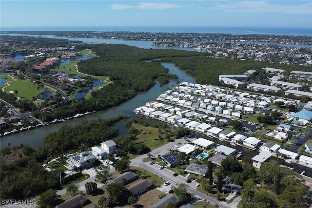 aerial view with a residential view and a water view