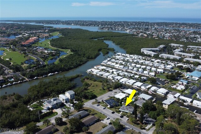 birds eye view of property with a water view and a residential view