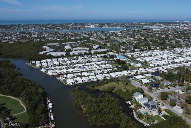 bird's eye view featuring a residential view and a water view