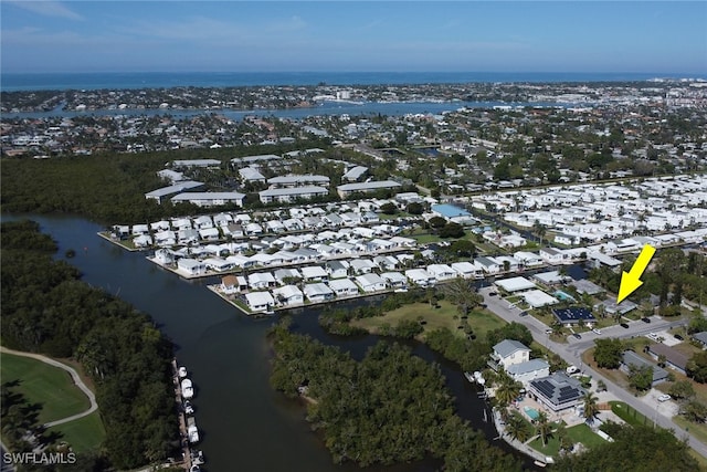 bird's eye view featuring a water view and a residential view