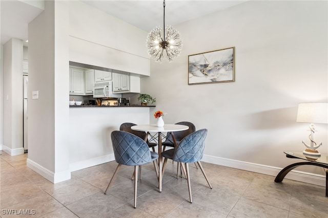 dining space featuring baseboards, light tile patterned floors, and a notable chandelier