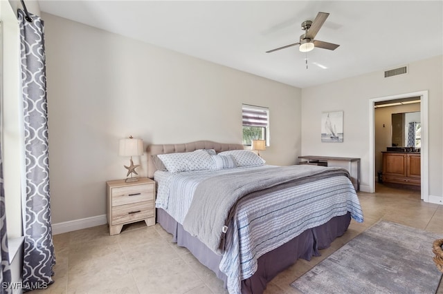 bedroom featuring light tile patterned floors, baseboards, and visible vents