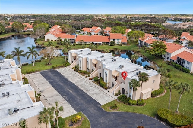 birds eye view of property featuring a water view and a residential view