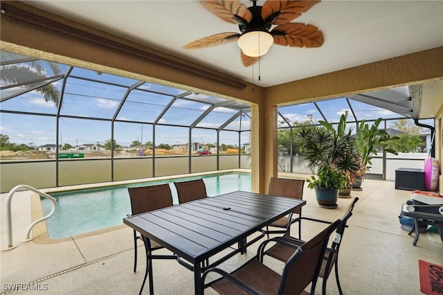 outdoor pool featuring a ceiling fan, a lanai, and a patio area