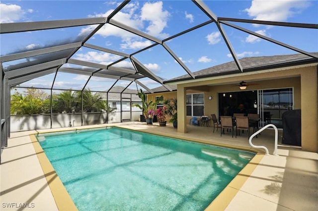 outdoor pool with a lanai and a patio