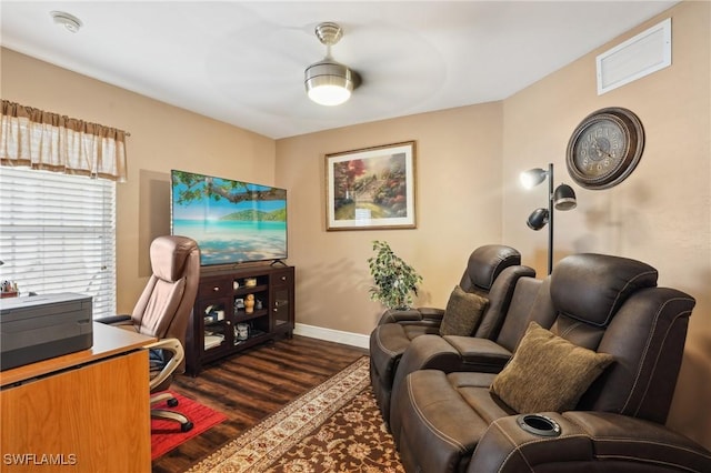 office area with dark wood-type flooring, visible vents, and baseboards