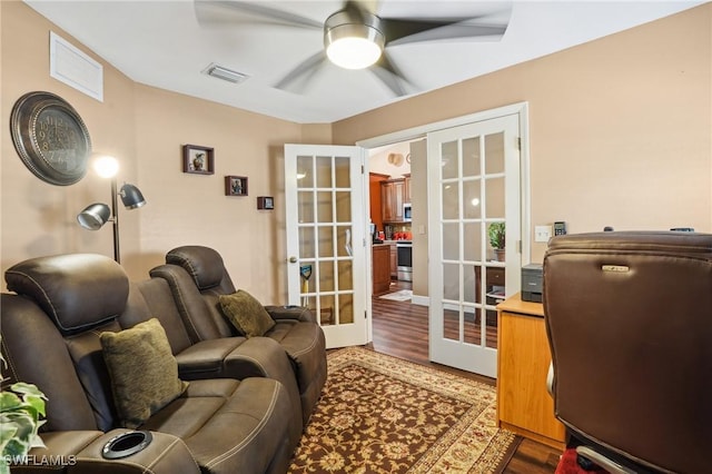 office space with ceiling fan, visible vents, wood finished floors, and french doors