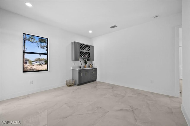 349 Rancho Ave, Lehigh Acres, FL 33974 - unfurnished room with recessed lighting, indoor wet bar, and baseboards