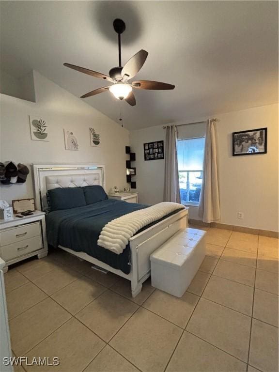 bedroom featuring light tile patterned floors, ceiling fan, and vaulted ceiling