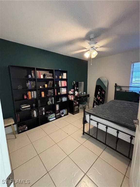 bedroom with tile patterned flooring and a ceiling fan