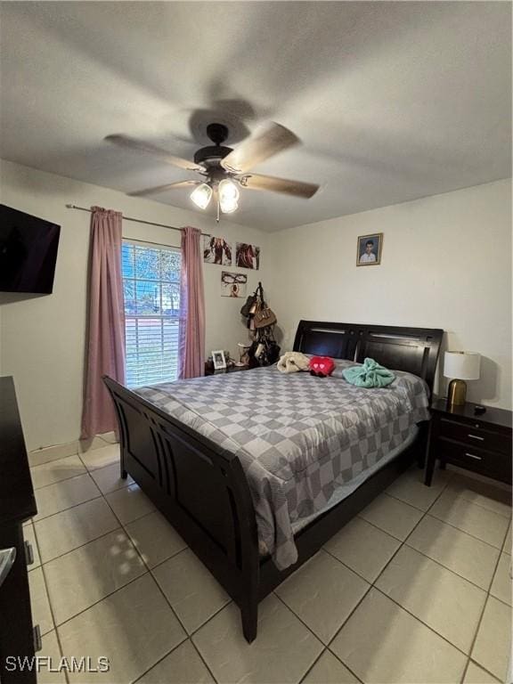 bedroom featuring light tile patterned floors and a ceiling fan