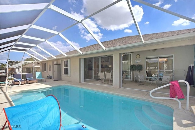 pool featuring a lanai and a patio