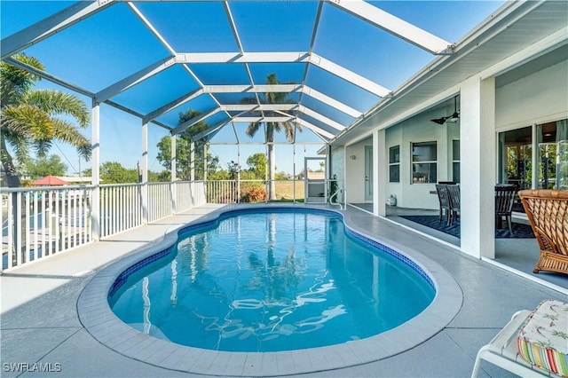 view of swimming pool with a lanai, a patio area, and a fenced in pool