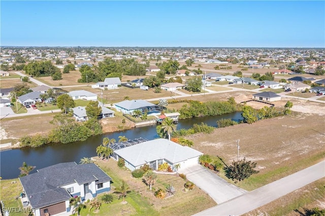 aerial view with a residential view and a water view