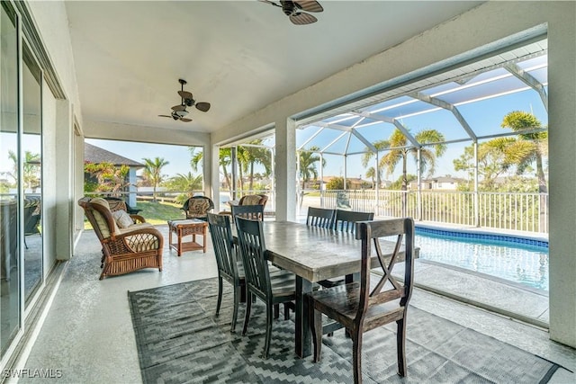 sunroom / solarium with a ceiling fan