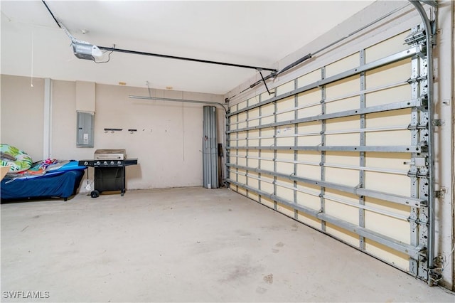 garage with electric panel and a garage door opener
