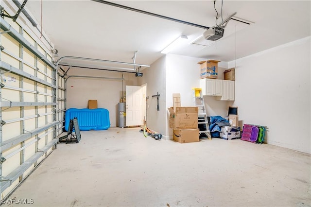 garage with electric water heater and a garage door opener