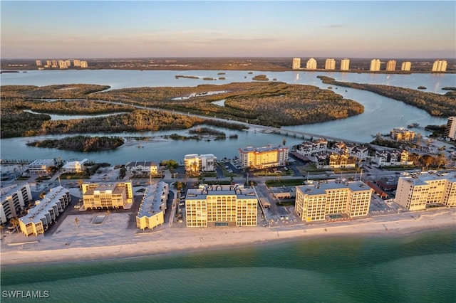 birds eye view of property with a view of city and a water view