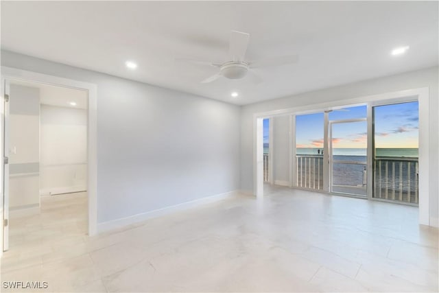 spare room featuring a ceiling fan, recessed lighting, and baseboards