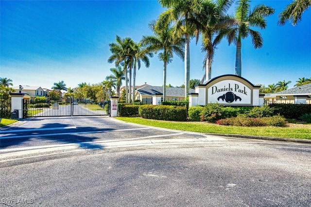 view of road with a gated entry and a gate