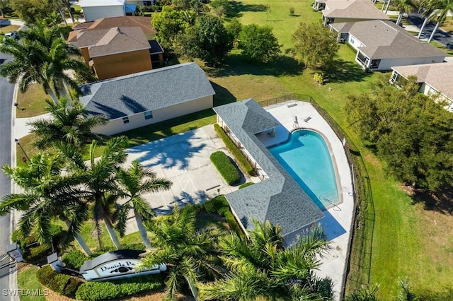 birds eye view of property with a residential view