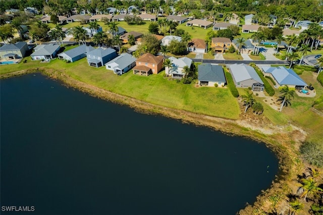 birds eye view of property featuring a water view and a residential view