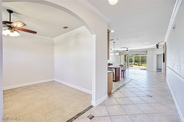 corridor featuring baseboards, visible vents, arched walkways, and ornamental molding