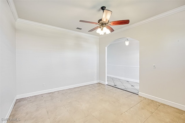 unfurnished room with arched walkways, ceiling fan, visible vents, baseboards, and ornamental molding