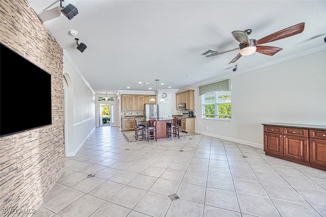 unfurnished living room with light tile patterned floors, ornamental molding, visible vents, and a ceiling fan