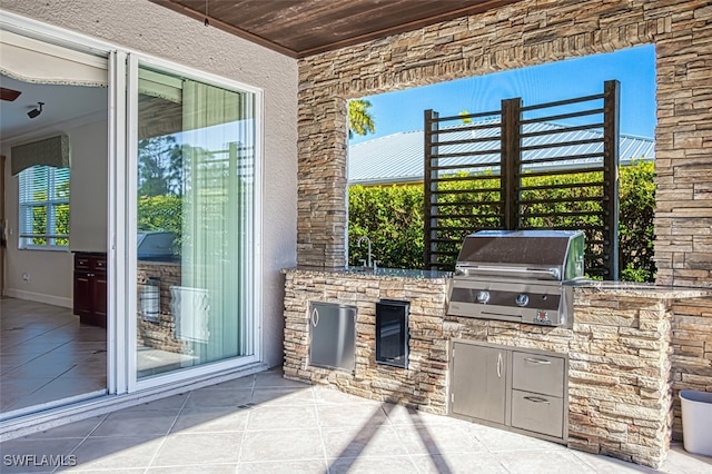 view of patio / terrace featuring a sink, a grill, and area for grilling