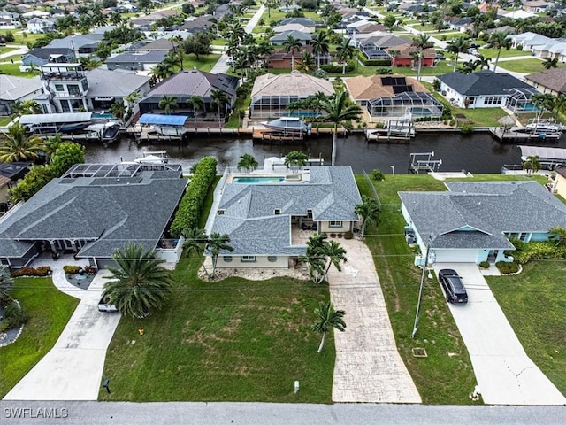 aerial view with a water view and a residential view