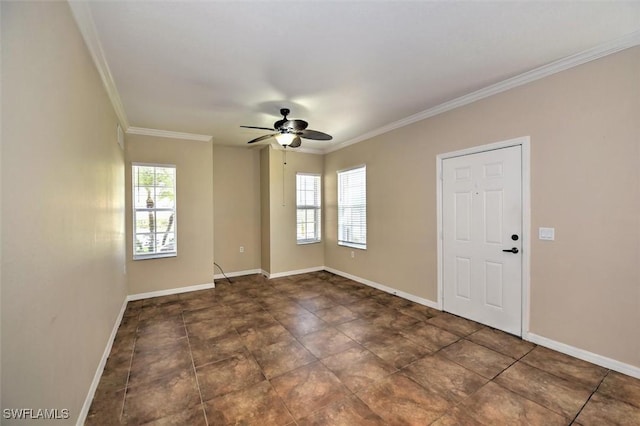 empty room with baseboards, ceiling fan, and crown molding