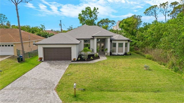 view of front of home with central AC unit, an attached garage, fence, decorative driveway, and a front lawn