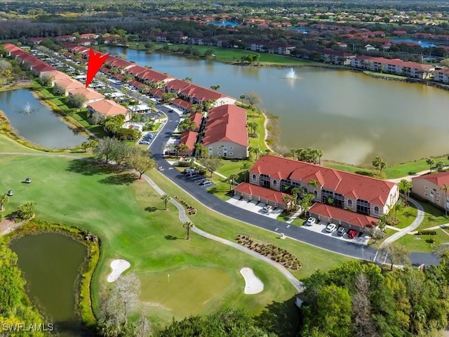 bird's eye view featuring view of golf course, a water view, and a residential view