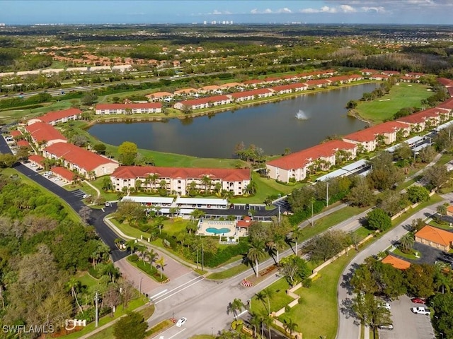 bird's eye view with a water view and a residential view