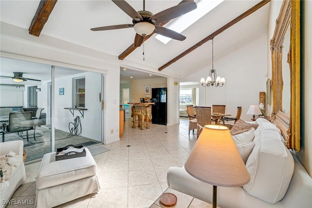 living area featuring vaulted ceiling with beams, light tile patterned floors, and ceiling fan with notable chandelier