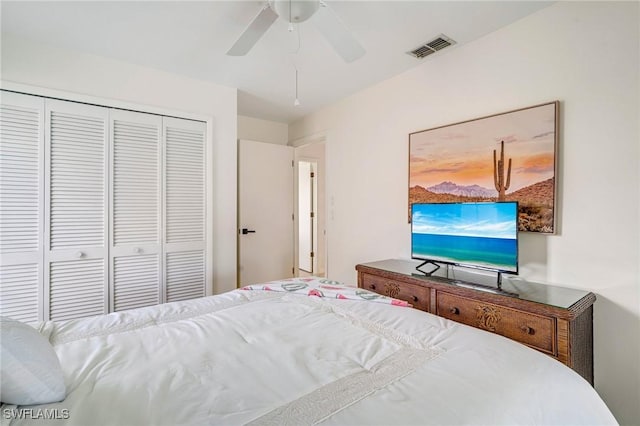 bedroom featuring a ceiling fan, a closet, and visible vents