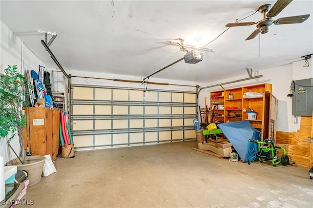 garage featuring ceiling fan, electric panel, and a garage door opener