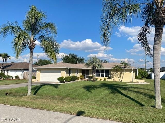 single story home featuring a garage, concrete driveway, a front lawn, and stucco siding