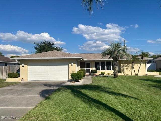 ranch-style home with a front yard, driveway, an attached garage, and stucco siding