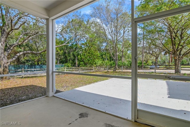 unfurnished sunroom featuring plenty of natural light