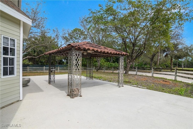 view of patio / terrace featuring a gazebo and fence