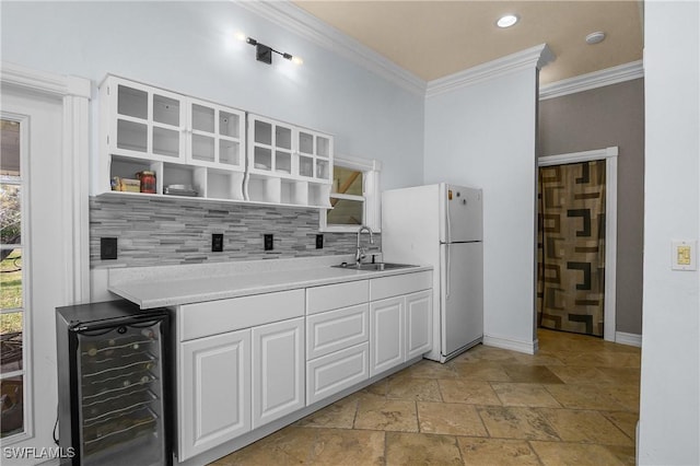 kitchen featuring beverage cooler, a sink, white cabinets, backsplash, and open shelves