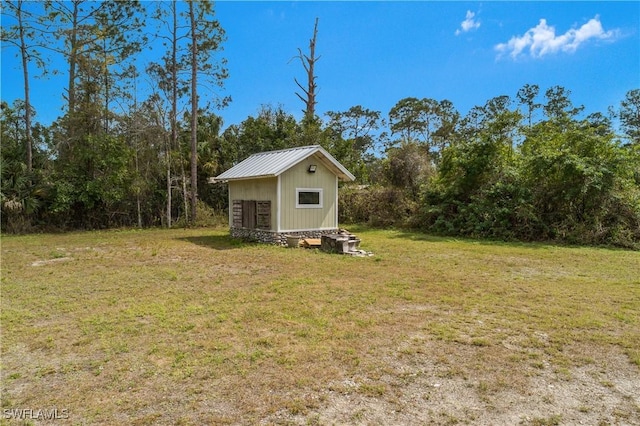 view of yard with a storage unit and an outdoor structure