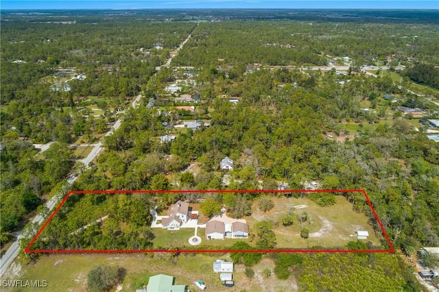 drone / aerial view with a view of trees