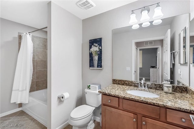 bathroom with toilet, tile patterned flooring, visible vents, and vanity