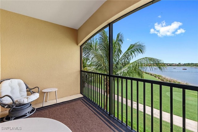 balcony featuring a water view