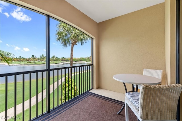 balcony featuring a water view