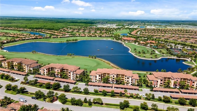 birds eye view of property featuring a water view and a residential view