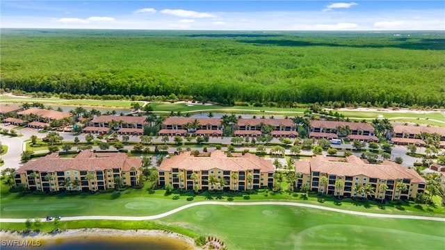 drone / aerial view with a water view and golf course view